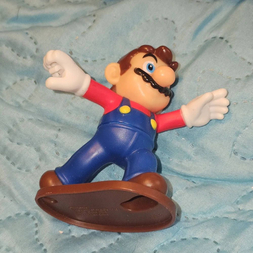 McDonald's Happy Meal toy featuring Mario from the Super Mario Bros. franchise.‎